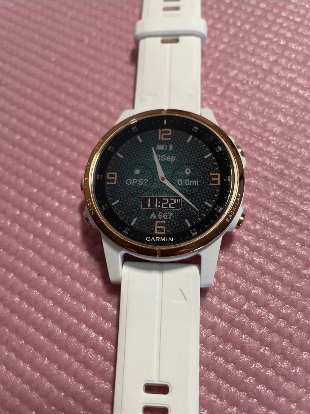 Garmin Fenix 5s Plus smartwatch in white with rose gold bezel
